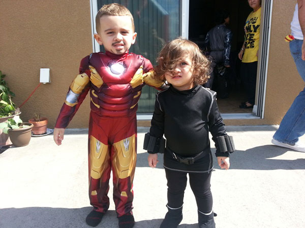 Toddlers Dressed As Iron Man And Black Widow