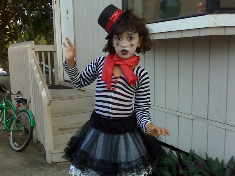 A Little Girl In A Mime Costume